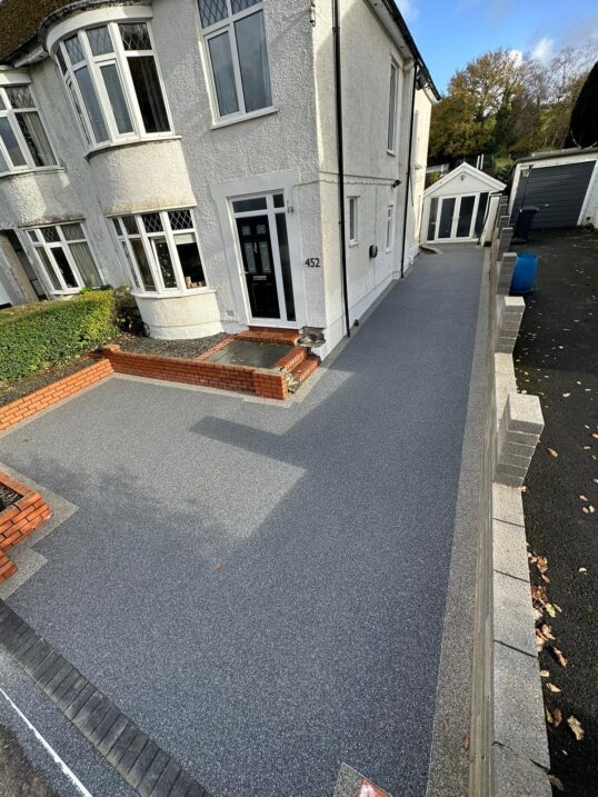 This is a photo of a grey resin driveway installed by Resin Driveways Wigan